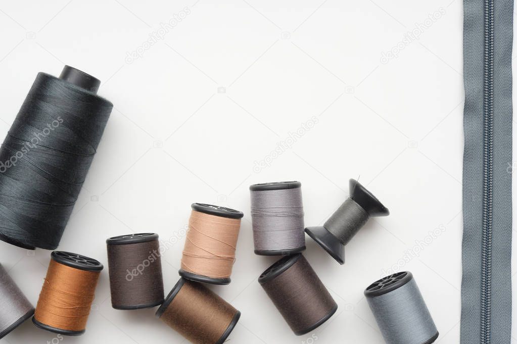 close up of colorful thread spools for background