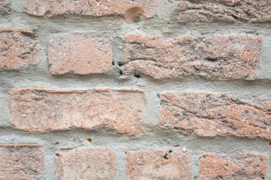 Eski binanın kahverengi yapısal taş duvarı tuğlalardan oluşur. Doğa yapısal arkaplan.