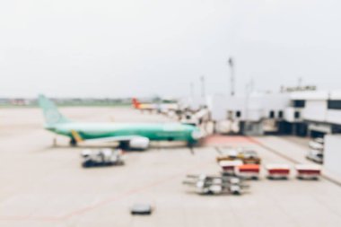 Blurred image of airplane waiting for passenger to boarding in a