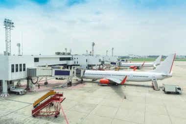 Airplane waiting for passenger to boarding in airport.