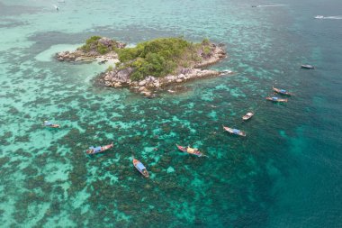 Aerial view of Thai traditional longtail boats and unidentified 