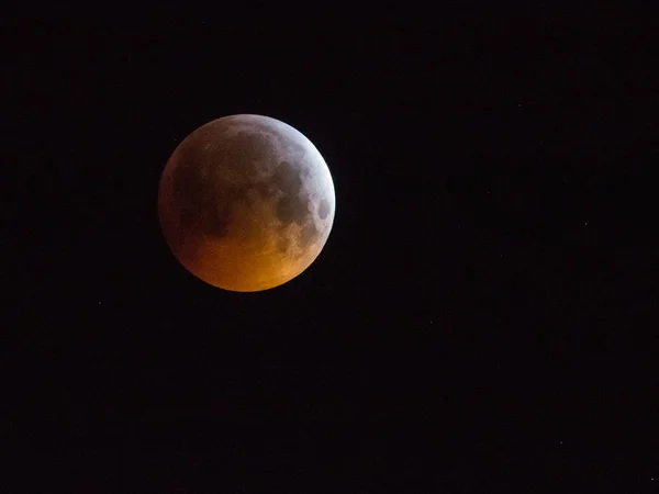 Super blood wolf moon, moon eclipse on sky, Amsterdam, The Netherlands - January 21, 2019