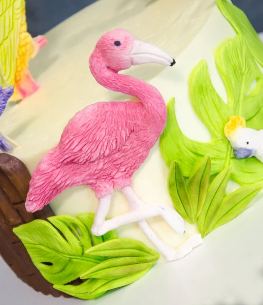 Fantastic tropical fondant cake with flamingo and a parrot