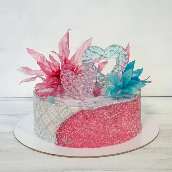 Pink blue sugar sheet cake with caramel and rice paper decoration