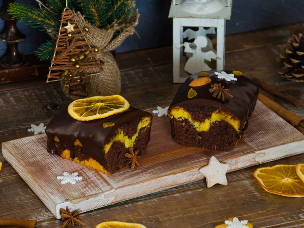 Chocolate orange Christmas  cake with fir tree and other decoration