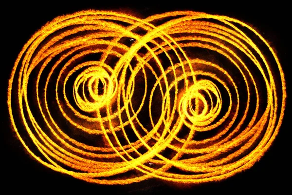 Chaotic golden neon circles pattern on black background.