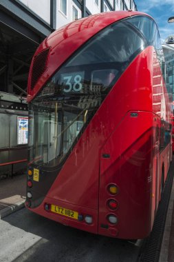 New Bus for London parked on a stand at Victoria Station clipart