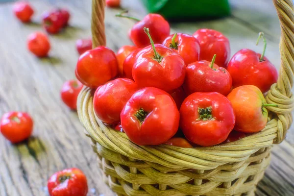 Thai Cherry in Gift Basket on wooden tables. Near the season of celebration. Gifts are something everyone wants.