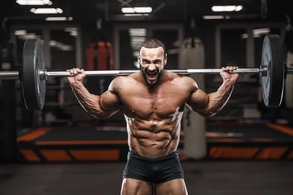 Brutal Forte Fisiculturista Atlético Homem Bombeamento Até Músculos Treino Musculação — Fotografia de Stock