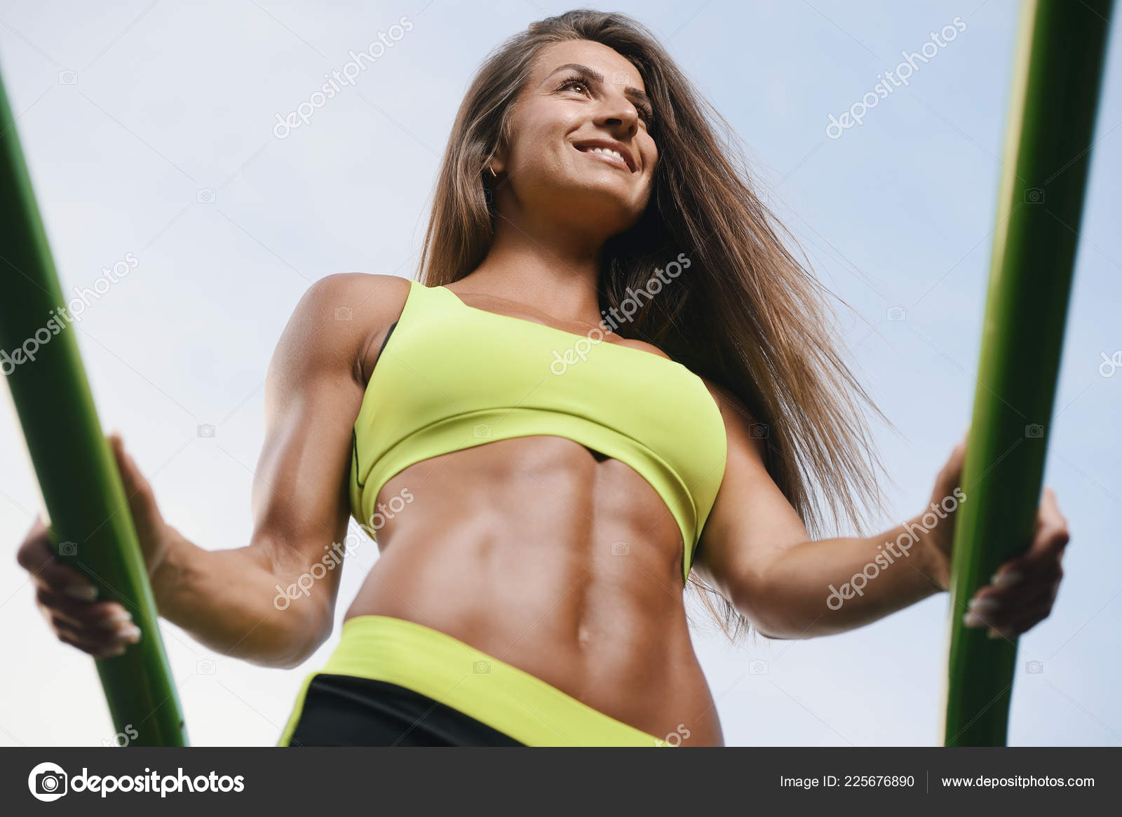 Beautiful abs. Young caucasian woman with athletic body shape is