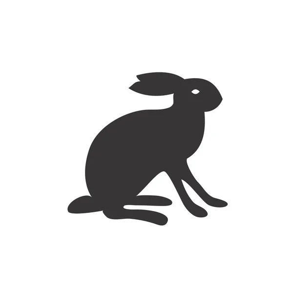 Schwarz-weiße Silhouette eines flauschigen Hasen oder Kaninchens auf weißem Hintergrund. geeignet als Logo, Symbol oder Gestaltungselement Ihrer Designprojekte. — Stockvektor