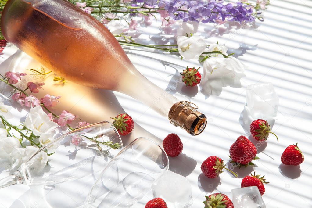 pink sparkling wine cold rose champagne  strawberry flowers ice