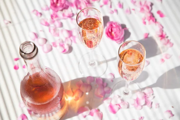 Glasses with champagne and an open bottle — Stock Photo, Image