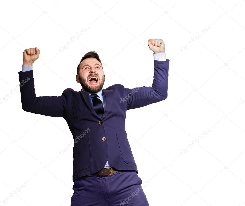 The concept of success, victory. Emotional portrait of a man in a suit on isolated white background.