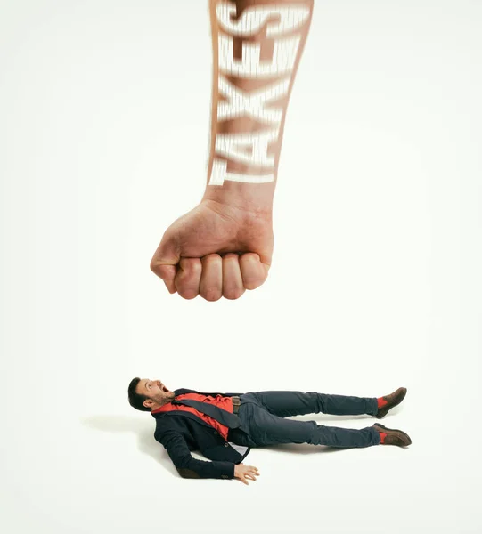 Big Human Fist Text Taxes Bring Man His Feet Concept — Stockfoto