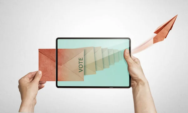 The human holds a digital tablet with paper envelope. Concept of e-voting via digital tablet.