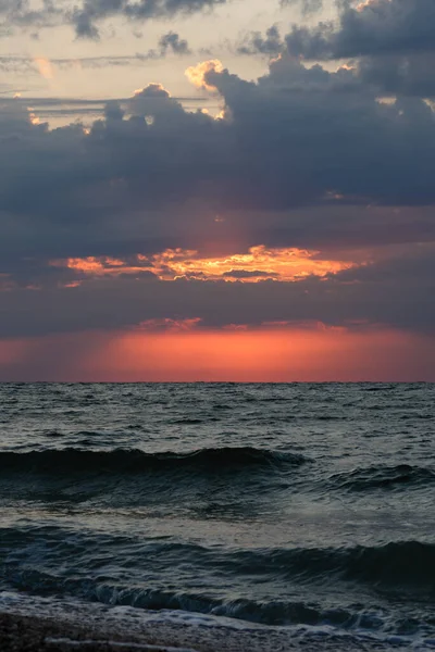 Beautiful  seascape. Dawn at  stormy sea. Image