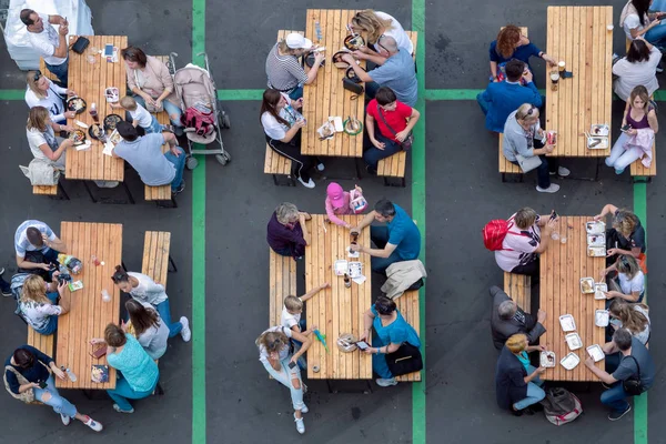 top view of the tables with people eating fast food