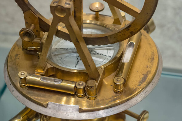 Old compass, astrolabe. Retro stale. Soft focus.