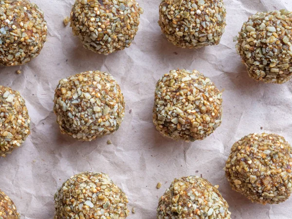 Top view of Low-fat energy balls with nuts on paper