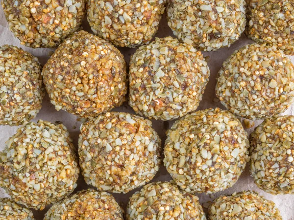 Top view of Low-fat energy balls with nuts on paper