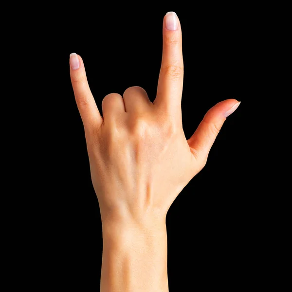 Mano femenina mostrando el signo de rock n roll o dando el gesto cuernos del diablo — Foto de Stock