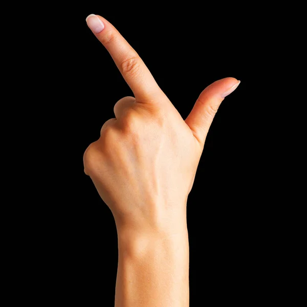 Mano de mujer con el dedo índice apuntando hacia arriba o mostrando gesto de perdedor — Foto de Stock