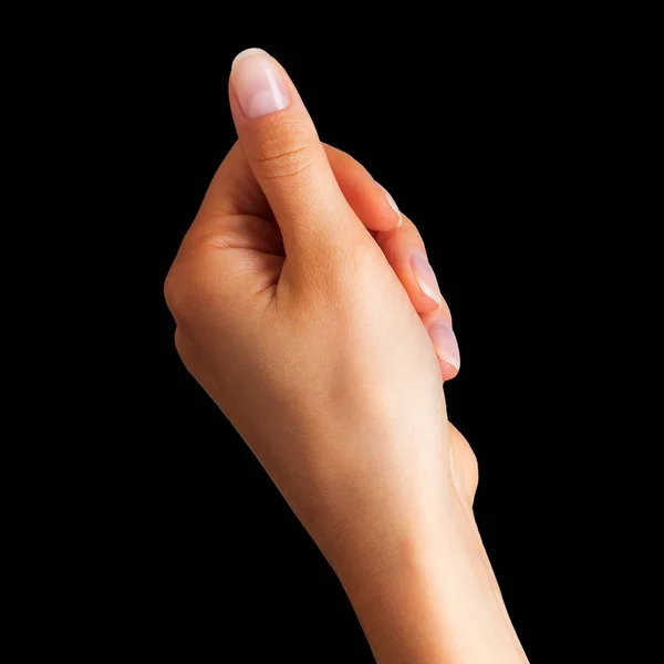 Woman hand holding something with two fingers