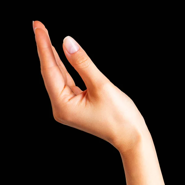 Mujer mano sosteniendo algo con dos dedos — Foto de Stock