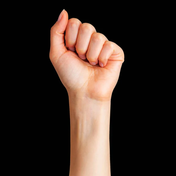 Uma mulher apertou o punho. Conceito de unidade, luta ou cooperação — Fotografia de Stock