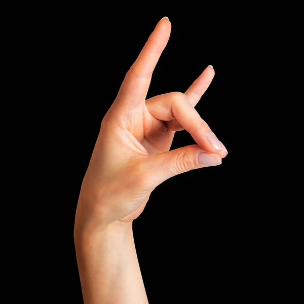 Mano femenina mostrando el signo de rock n roll o dando el gesto cuernos del diablo — Foto de Stock