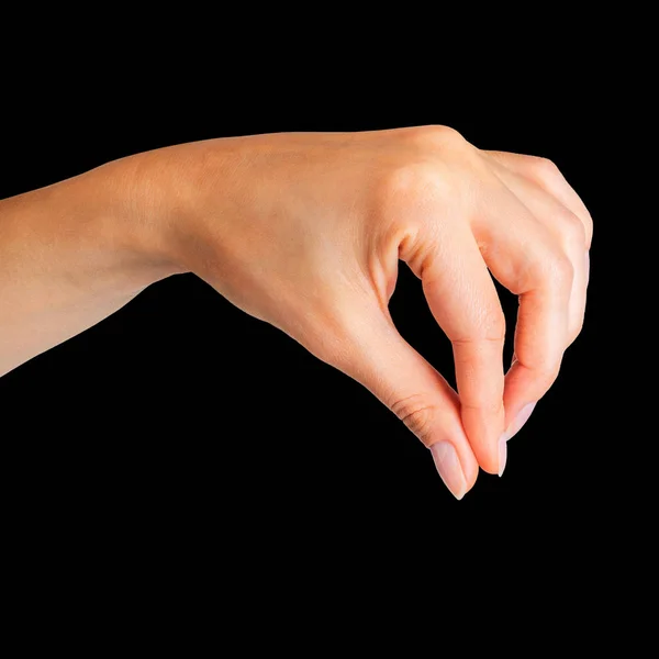 Frauenhand hält mit zwei Fingern etwas Kleines — Stockfoto