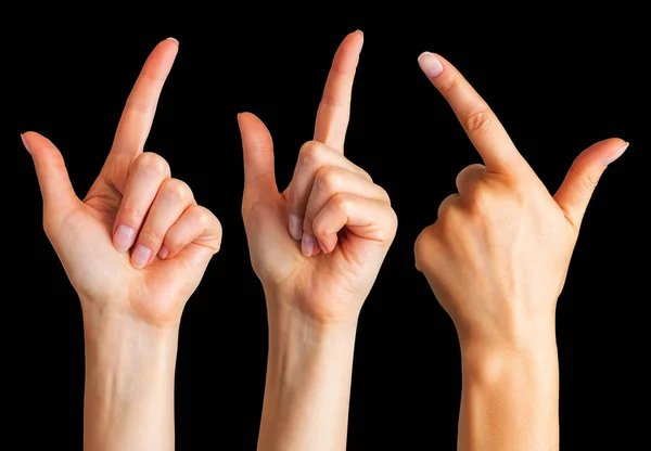 Manos de mujer con el dedo índice apuntando hacia arriba —  Fotos de Stock