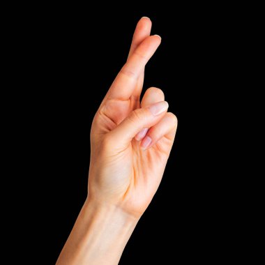 Kadın eliyle kenetlenmiş parmaklar, iyi şanslar sembolü jesti