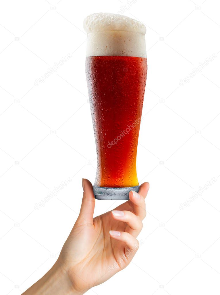 Woman hand holding mug of beer with foam on white background