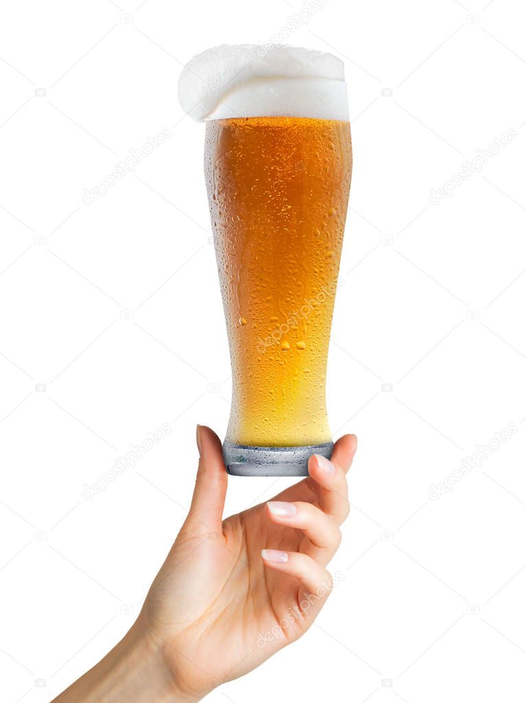 Woman hand holding mug of beer with foam on white background