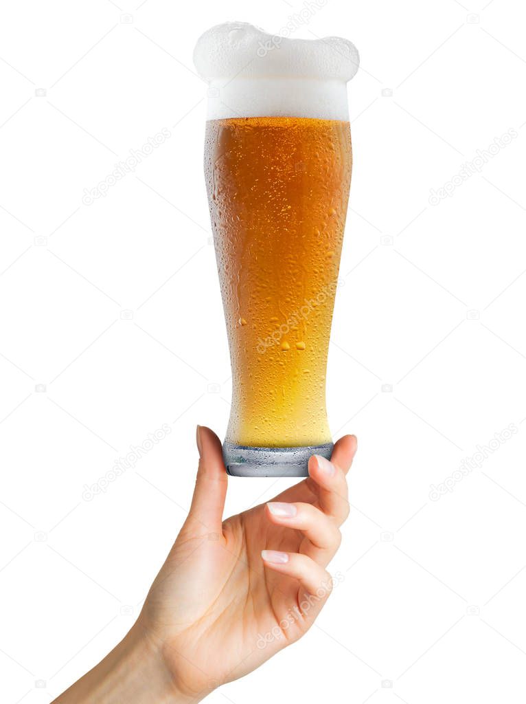 Woman hand holding mug of beer with foam on white background