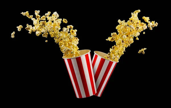 Set aus Papiereimern mit Popcorn isoliert auf schwarzem Hintergrund — Stockfoto