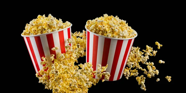 Set van papier gestreepte emmers met popcorn geïsoleerd op zwarte achtergrond — Stockfoto