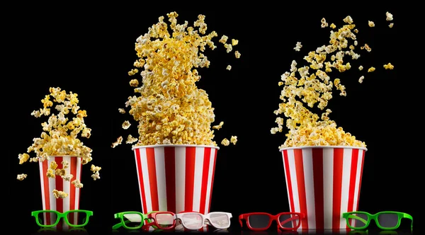 Eimer mit Popcorn und 3D-Gläsern isoliert auf schwarzem Hintergrund — Stockfoto