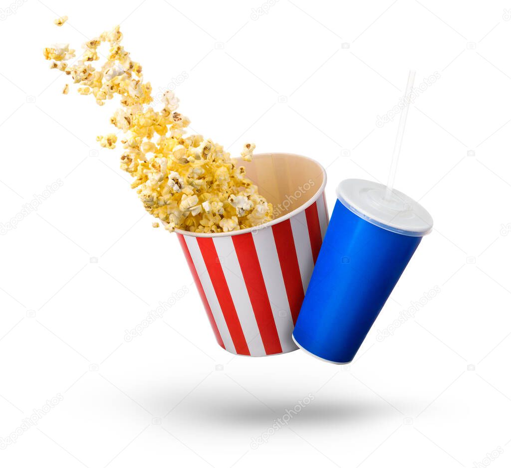Paper striped bucket with popcorn and cup of soft drink isolated on white
