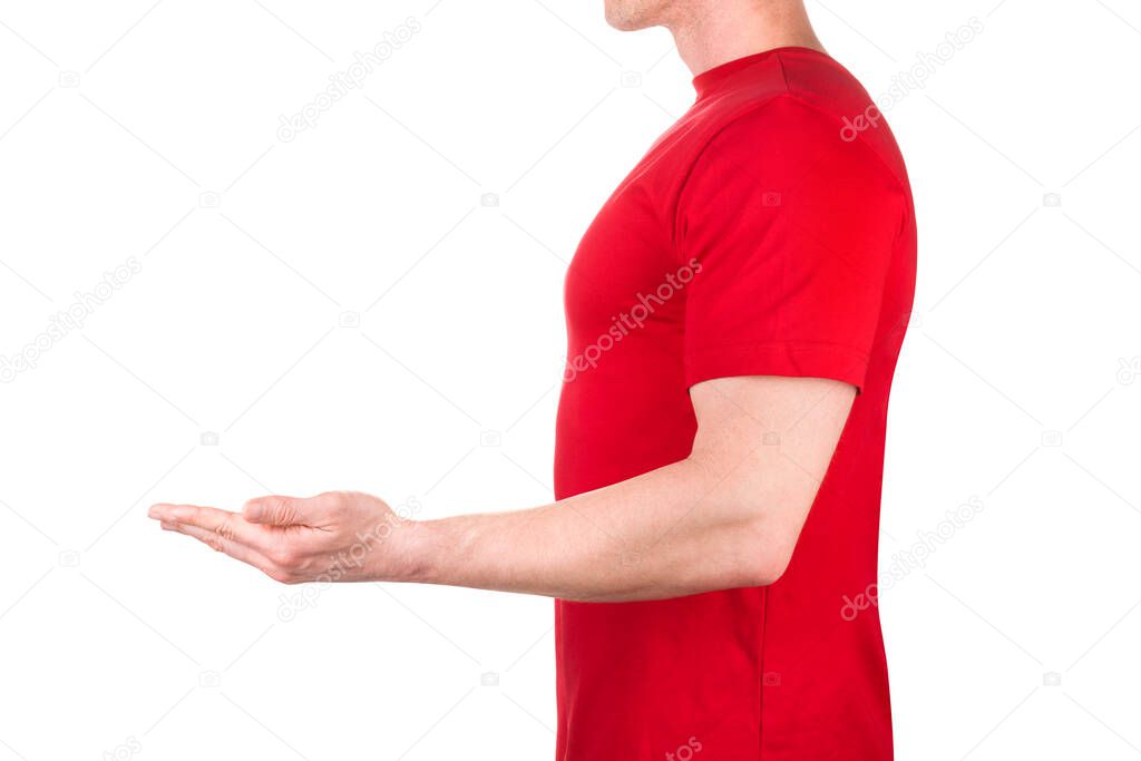 Front view of confident male in blank red t-shirt hold something isolated white