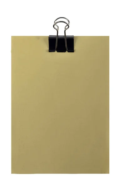 Yellow paper with blank space for text, message or memo and black clip on white background — 스톡 사진