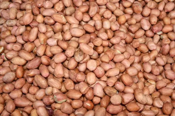 Крупный план и вид сверху на арахисовую текстуру, пищевой фон — стоковое фото