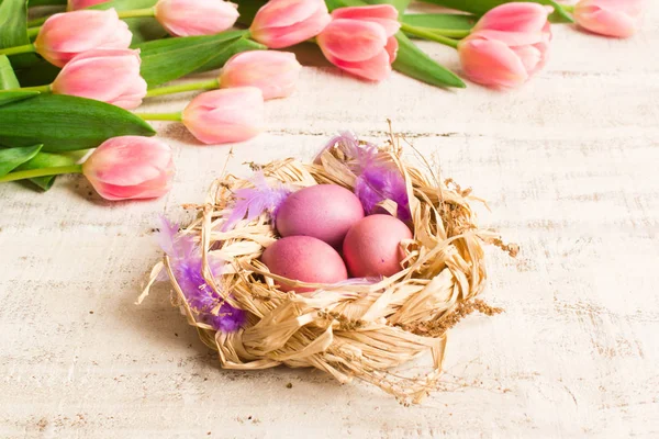 Eater eggs and pink tulips. Easter card
