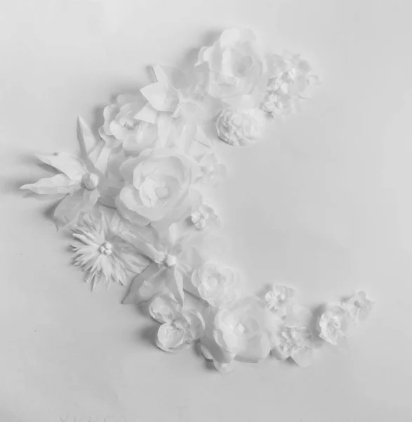 White flowers on a white  background. Card. Everything is made of paper. A place for congratulations.