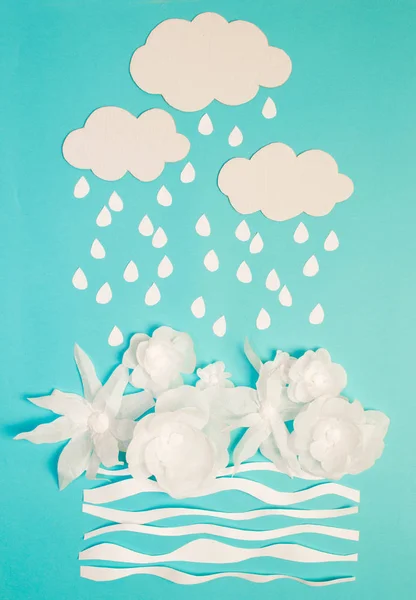 White flowers under rain. Card. Everything is made of paper. A place for congratulations.