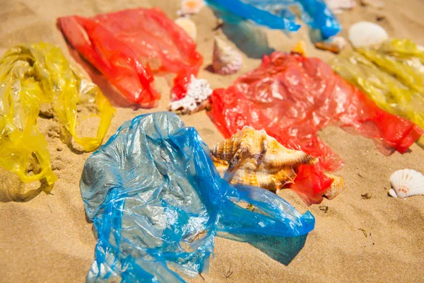 Close Colorful Overwrap Bags Seashells Sandy Beach — Stock Photo, Image