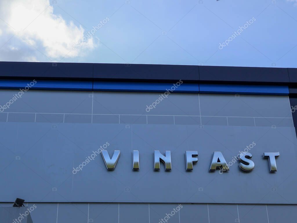 Balikpapan-indonesia september 13, 2025 VinFast logo sign on modern building wall with blue sky background