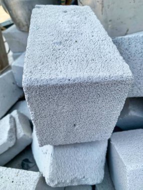 Close-up of lightweight concrete block (hebel) with rough texture stacked in construction site. Clear detail and sharp focus. Perfect for building, architecture, and industry concept.